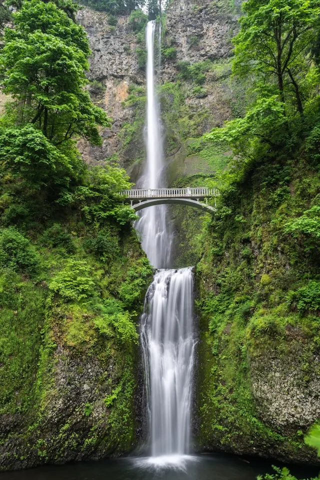 Alpine waterfall beside a rail route