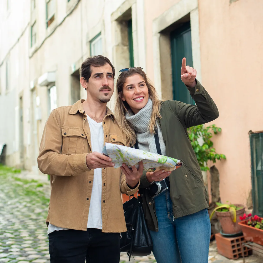 Travelers planning their route with a map